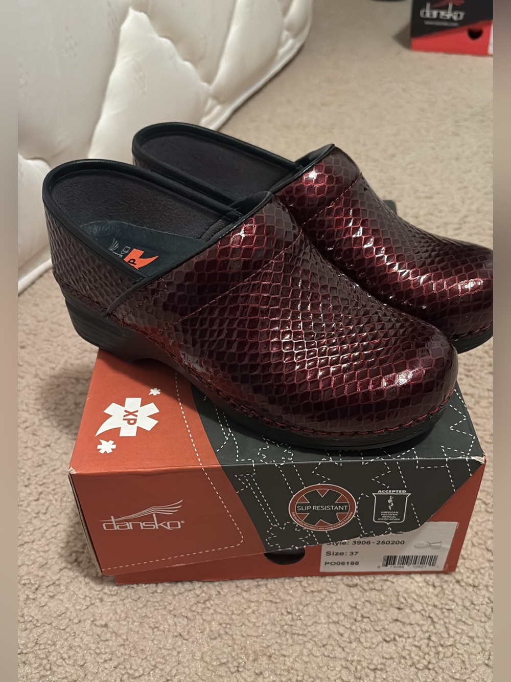 Dansko Women's Burgundy Snake-Embossed Clogs